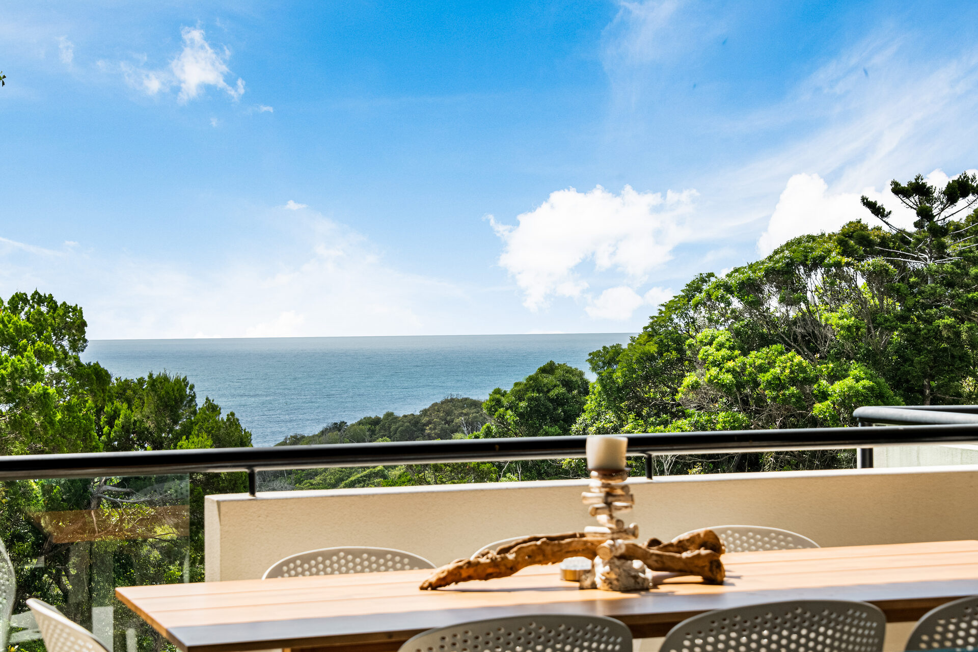 Deck dining with panoramic ocean views