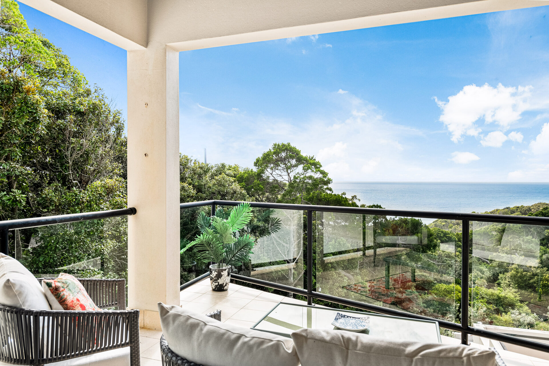 Deck lounge seating overlooking the coast