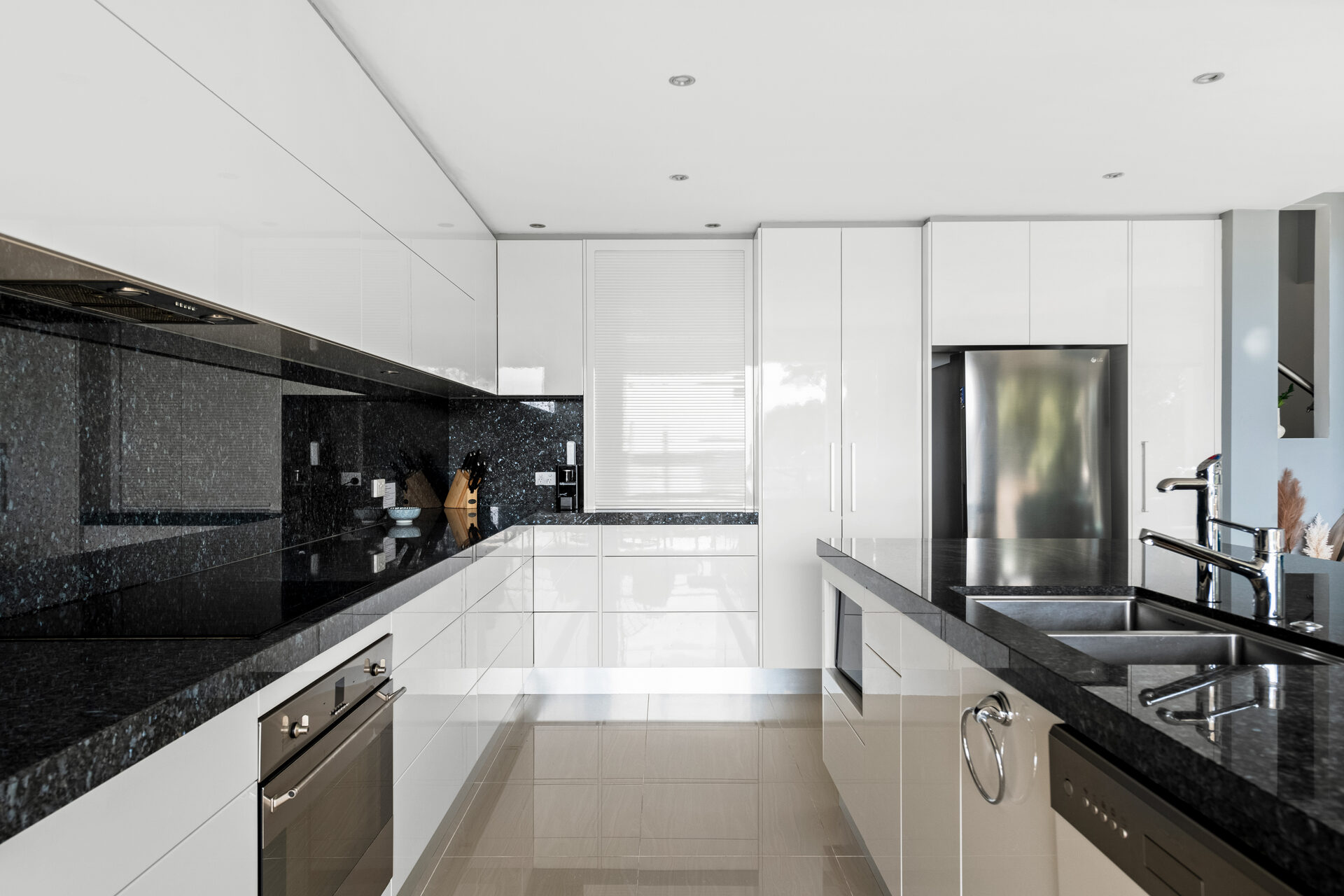 Kitchen detail with granite benchtops and stainless appliances