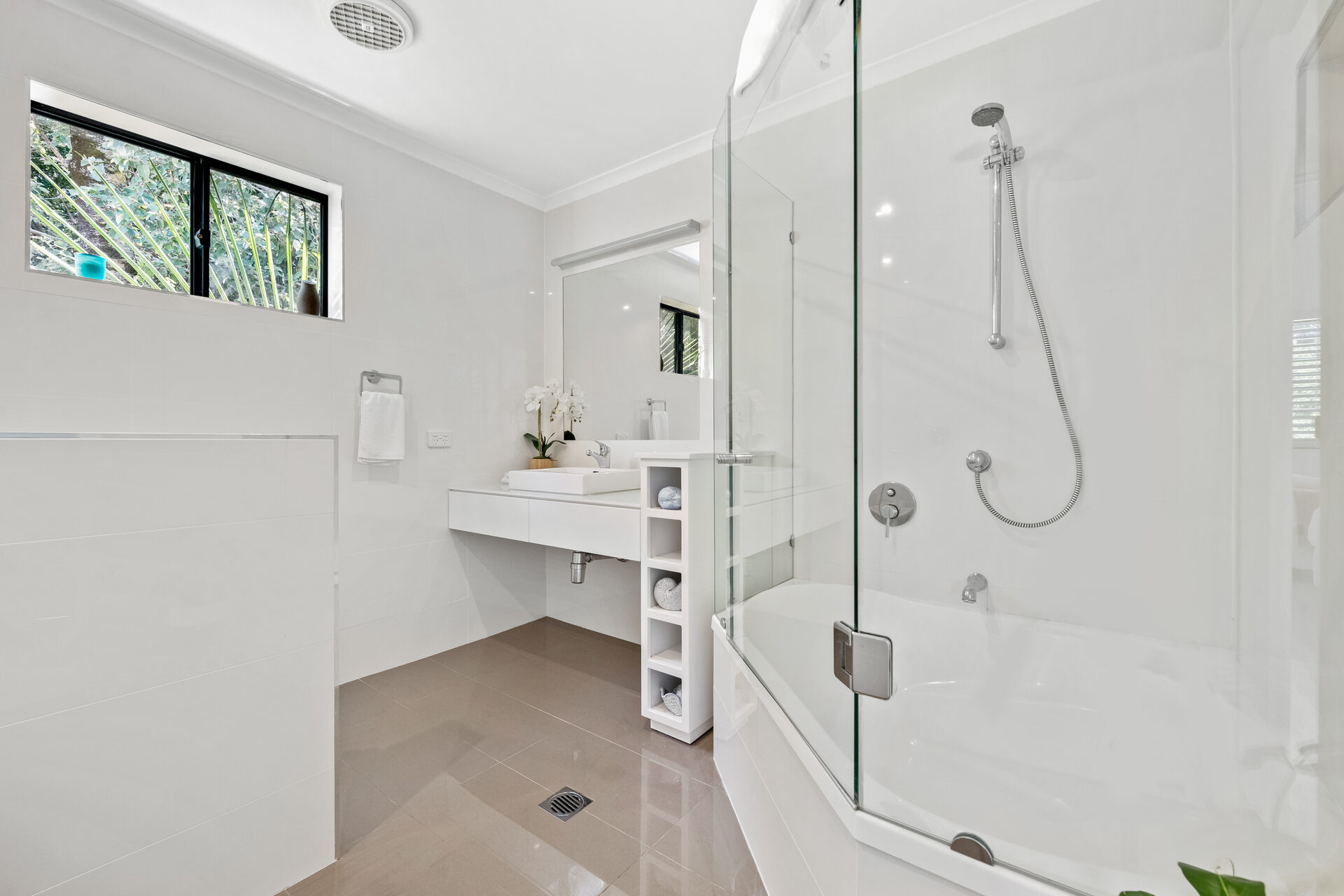 Bathroom with glass shower and bath combo